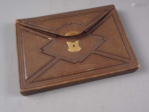 A mid 19th century leather writing wallet with part fitted i...