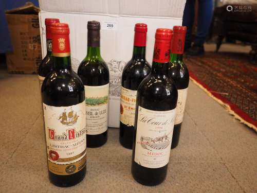 Three bottles of Chateau La Tour de By, a bottle of 1995 Cha...