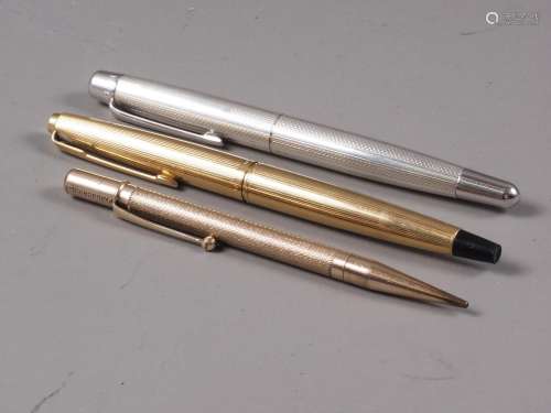 A gold coloured Parker fountain pen, a rolled gold propellin...