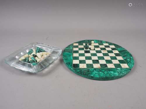 A malachite and hardstone chess set, on circular inlaid mala...
