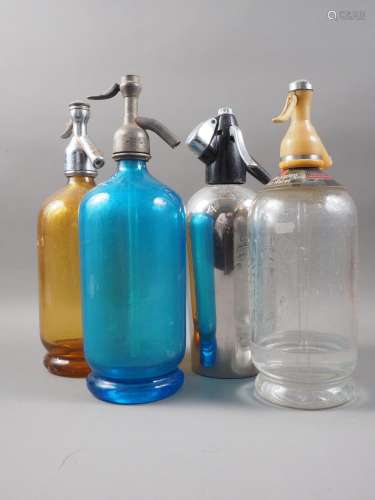 A blue glass soda siphon, an amber glass soda siphon and two...