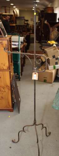 A wrought iron standard lamp, on tripod splay supports, 63 1...
