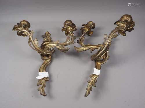 A pair of 19th century gilt brass Rococo scroll two-light wa...