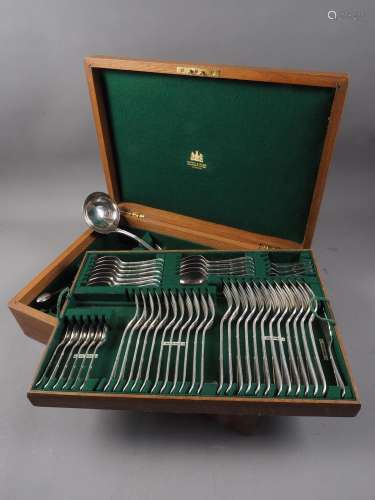 An oak part canteen of Mappin and Webb silver plated cutlery