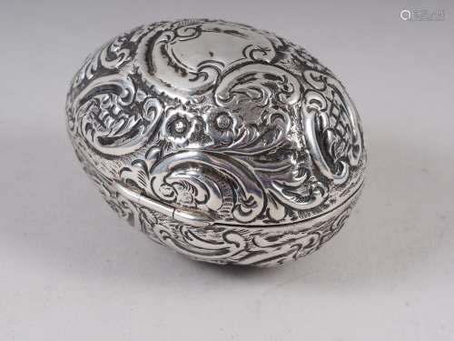 A late 19th century chased and engraved silver egg with parc...