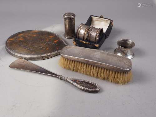 A tortoiseshell and silver mounted hand mirror, a matching s...