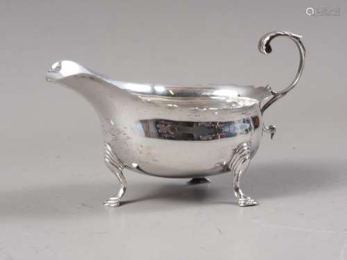 A silver sauce boat with scrolled handle, 3.2oz troy approx