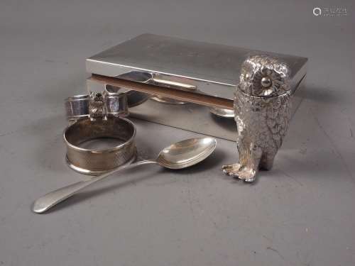 An engine turned cigarette box, two silver napkin rings, a s...
