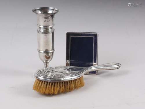 An embossed silver backed hair brush, a Mappin & Webb si...