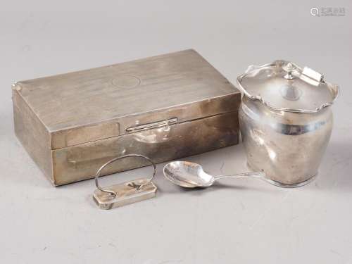 A silver cigarette box, a silver tea caddy, a silver caddy s...
