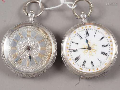 A silver cased fob watch with engraved case and silver dial ...