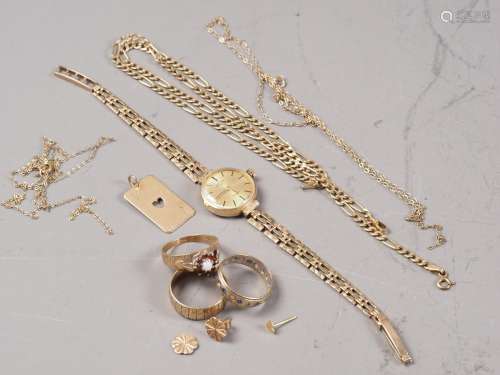 A selection of 9ct gold jewellery, including a wedding band,...