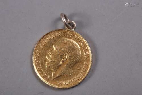 A gold sovereign, dated 1911 (hard mounted)