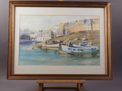 A watercolour coastal scene with cottages and small boats, 1...