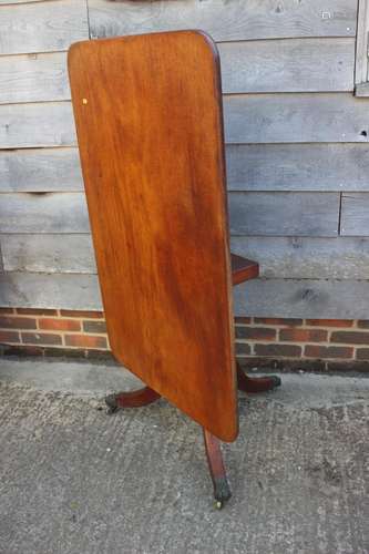 A 19th century mahogany tilt top breakfast table, on turned ...