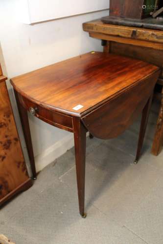 A late 19th century mahogany oval Pembroke table, fitted one...