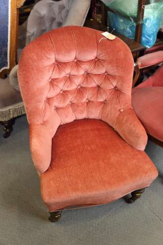 A late 19th century tub seat armchair, button upholstered in...