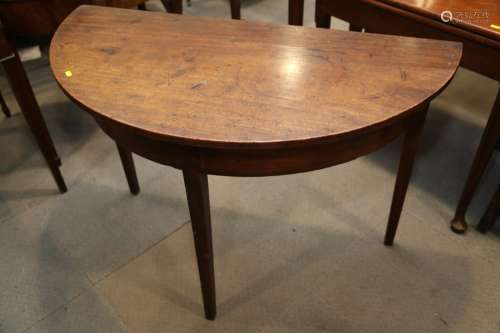 A 19th century mahogany semicircular side table, on square t...