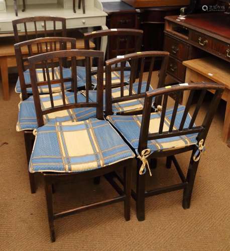 A Harlequin set of six early 19th century vertical rail back...