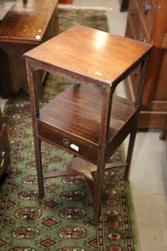 A late 19th century mahogany three-tier washstand, fitted on...
