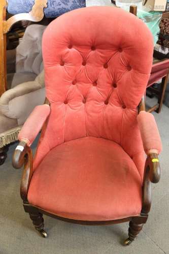 A 19th century rosewood framed scroll arm chair, upholstered...