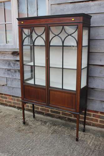 A late 19th century walnut and line inlaid display cabinet e...