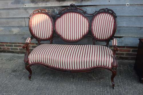 A 19th century carved rosewood showframe three-seat settee w...