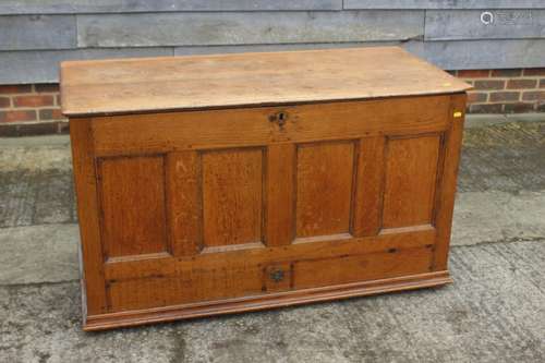 A Georgian oak four-panel front coffer with faux drawers, on...