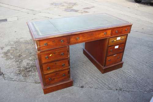 A late 19th century mahogany double pedestal desk with toole...