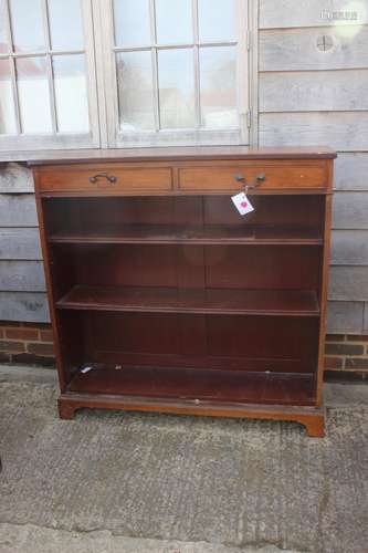 A Maples late 19th century walnut bookcase, fitted two drawe...