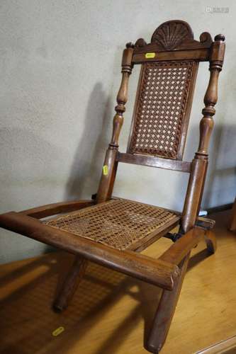 A childs Victorian polished as walnut folding chair with can...