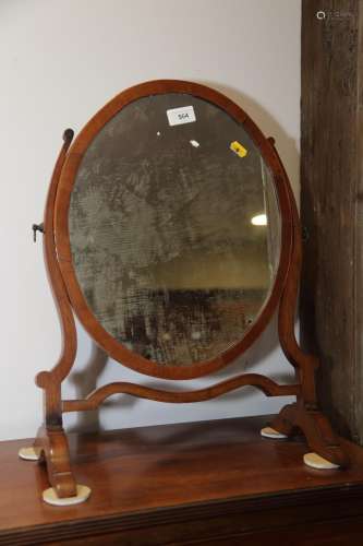 A mahogany and inlaid oval swingframe toilet mirror, on skel...