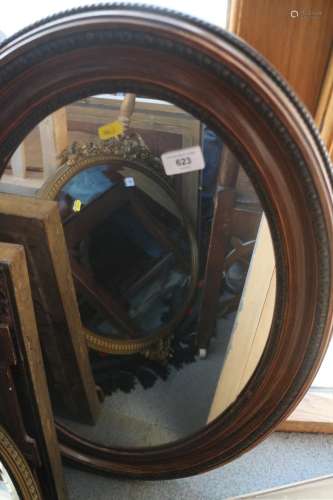 A polished as walnut oval framed wall mirror, plate 26 x 16