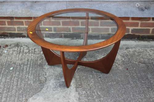 A G Plan teak circular top occasional table, on X frame supp...