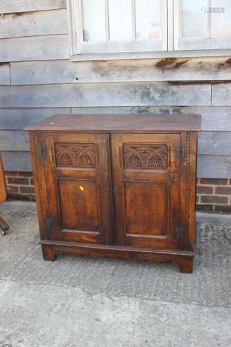 An oak panelled cupboard of 17th century design enclosed two...