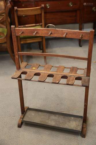 An early 20th century mahogany boot stand with brass carry h...