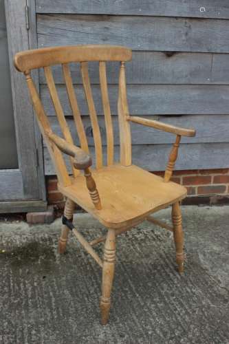 A beech Windsor lath back farmhouse elbow chair (damages)