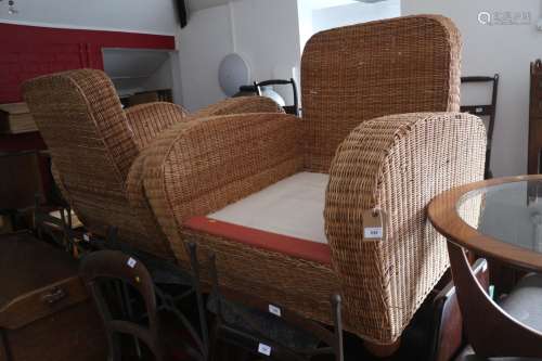 A pair of 1930s design square arm rattan armchairs, on bun f...