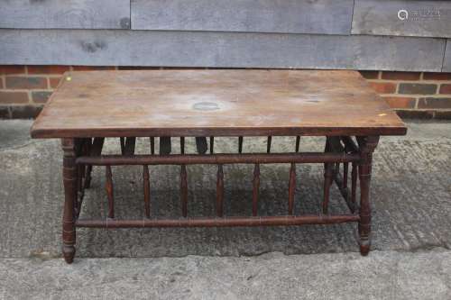 An Arts & Crafts elm and ash low occasional table with s...