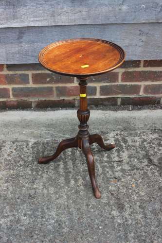 A mahogany wine table, on turned column and tripod support, ...