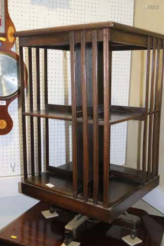 An early 20th century oak revolving bookcase, 18 square x 32...