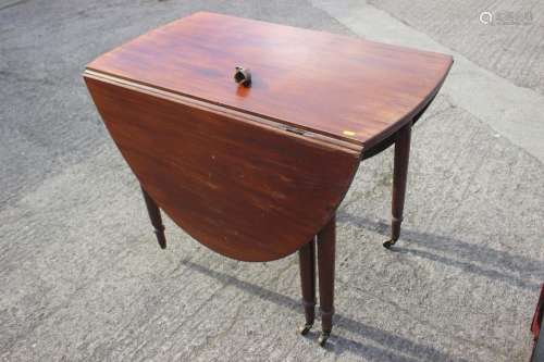 A mahogany oval drop leaf dining table, on turned and castor...