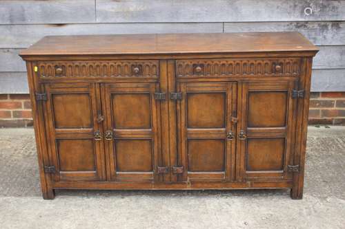 A dark oak sideboard of 17th century design, fitted two draw...