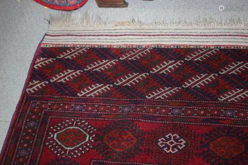 A Bokhara rug of traditional design with seventy-five medall...