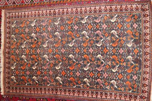 A Caucasian rug with all-over bird design on dark blue groun...