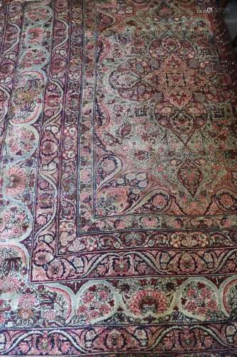 A fragment of a Persian city carpet with part central medall...