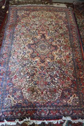 A Kashan type rug with central medallion and all-over floral...