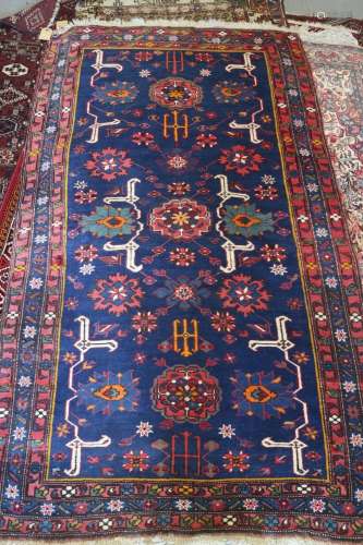 A Kuba rug with three medallions, candelabra and stylised bi...