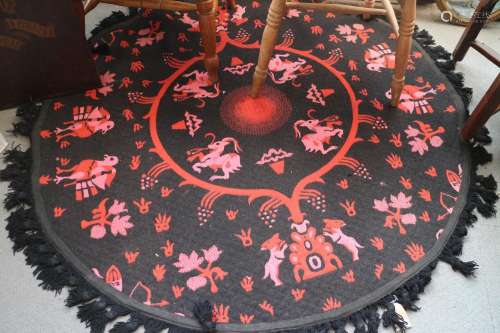 A Casa Pupo rug with animal design in shades of red, black a...