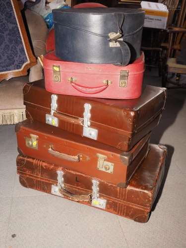A practically unused leather vintage suitcase and a number o...